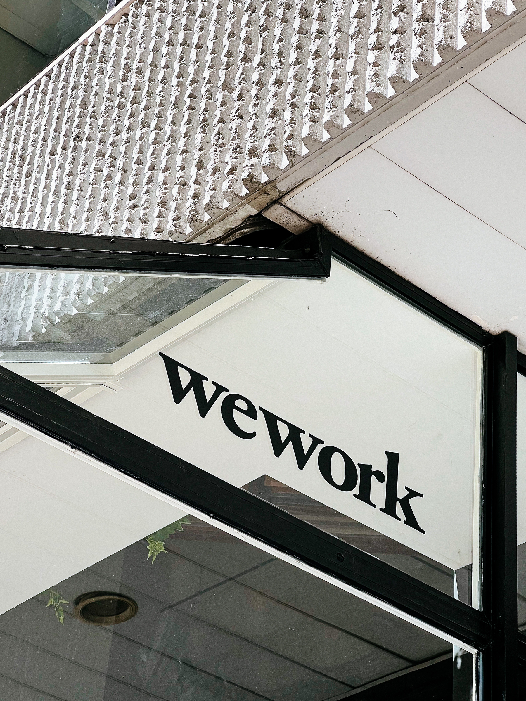 a wework sign on a window