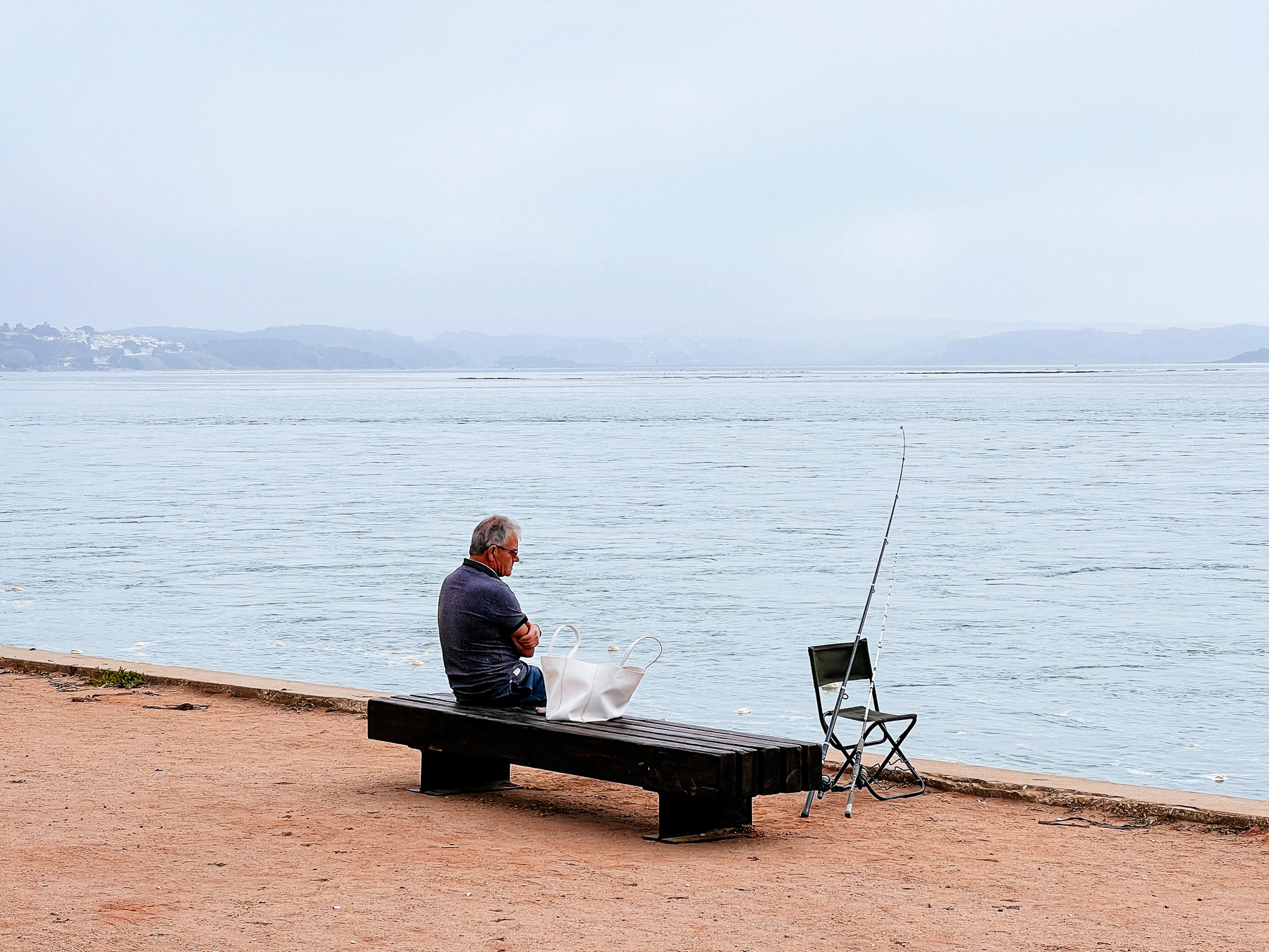 A fisherman by the lake