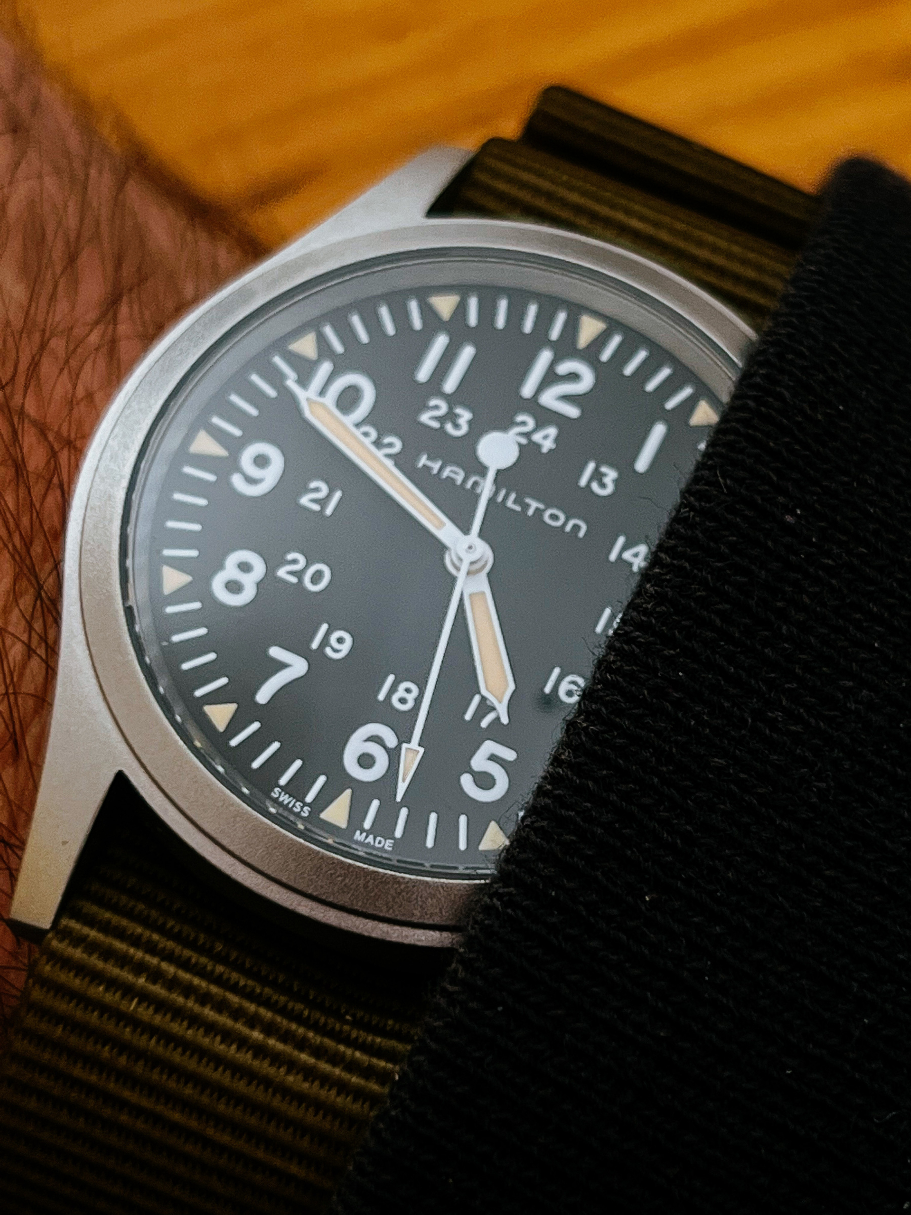 a close up of a watch, a hamilton khaki field mechanichal