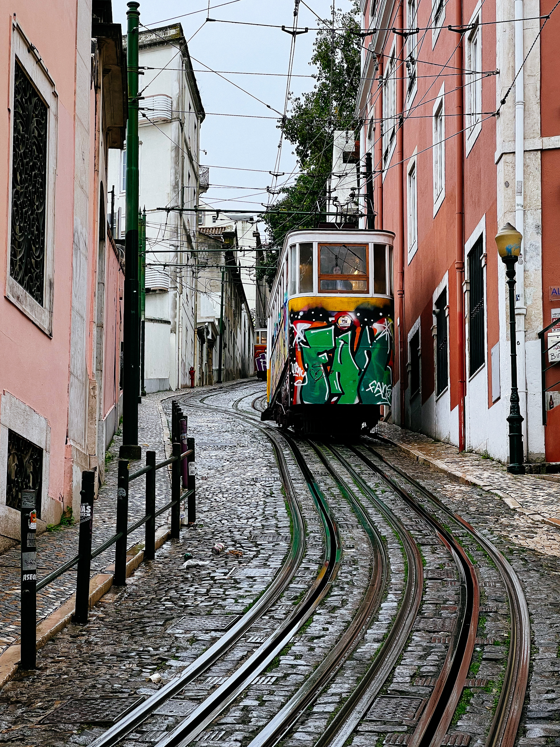 a tram coming down a very steep street