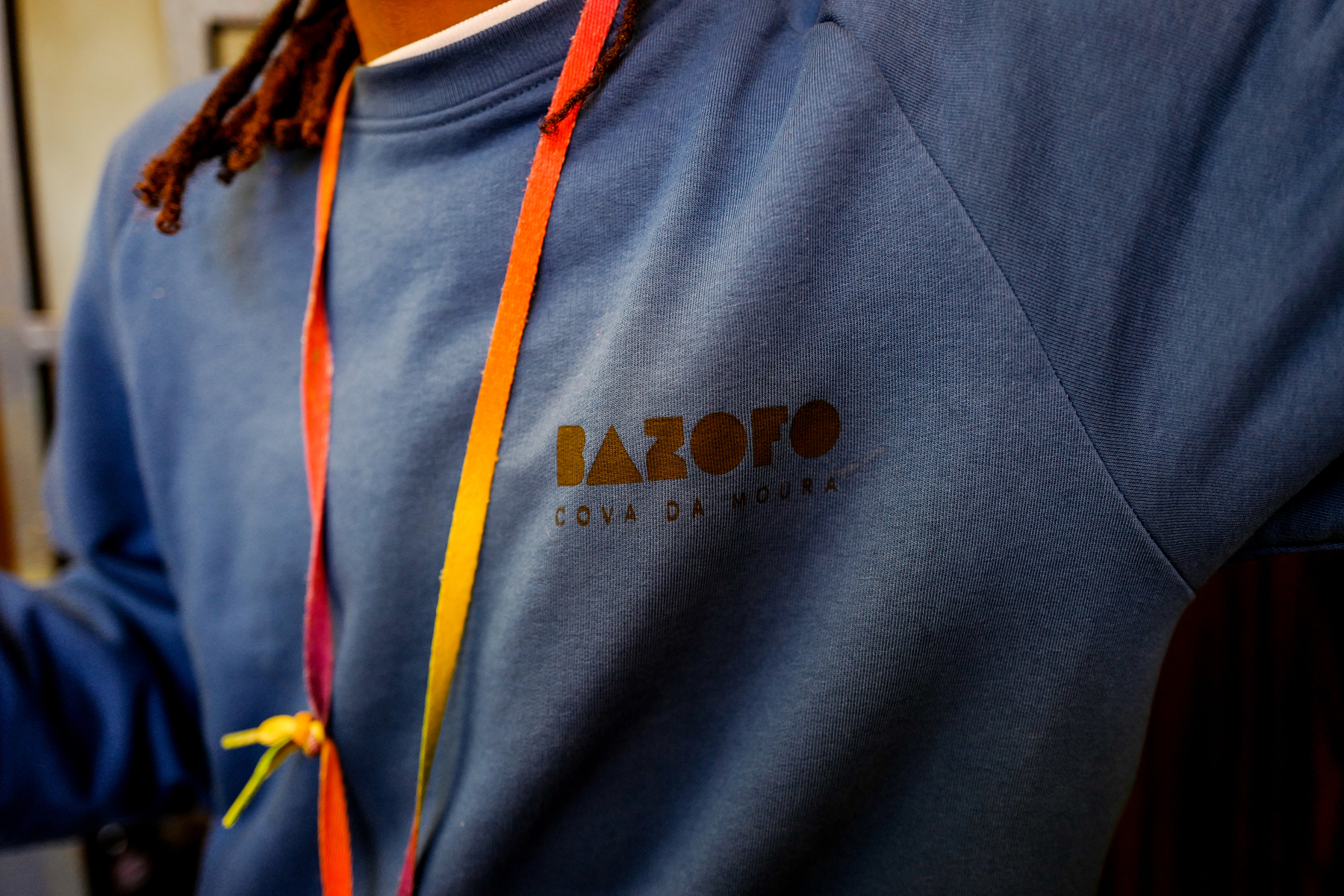 Closeup of a sweatshirt, you can read the brand “Bazofo”