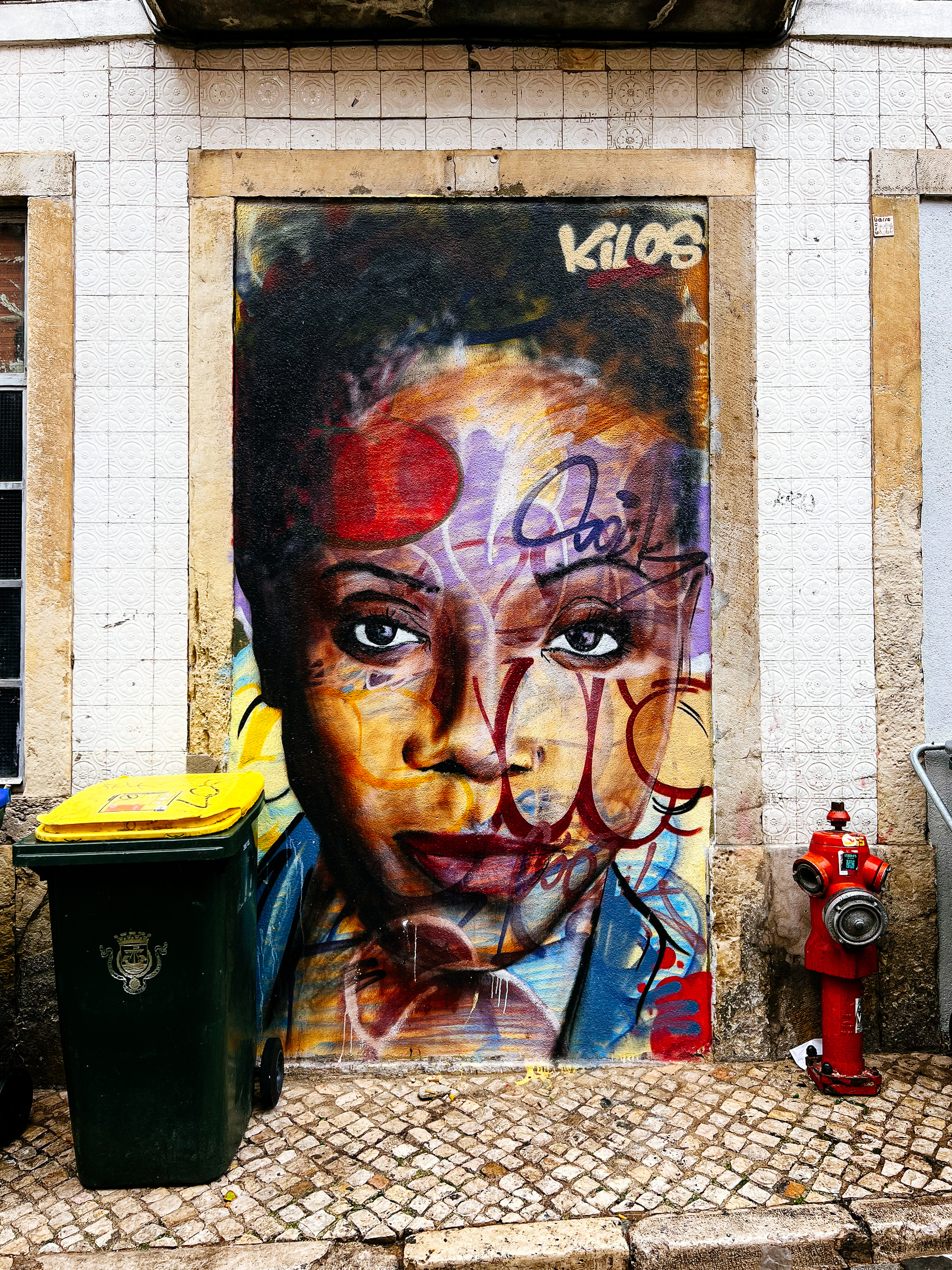 Street art, a woman portrait, looking at us with a serious face. 