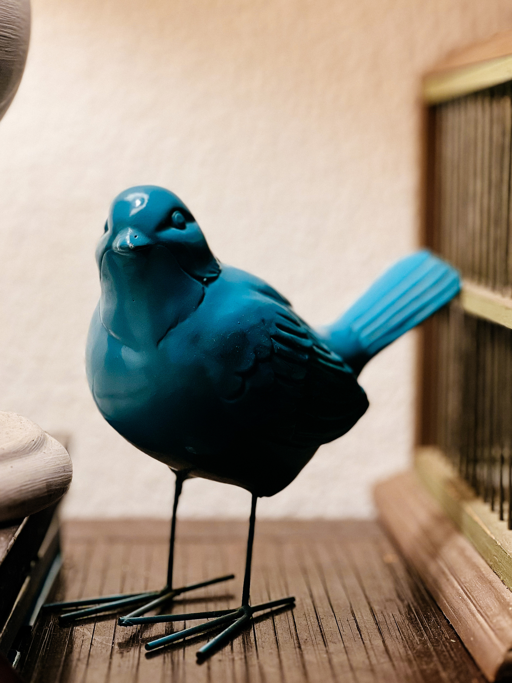 A blue ceramic bird. 