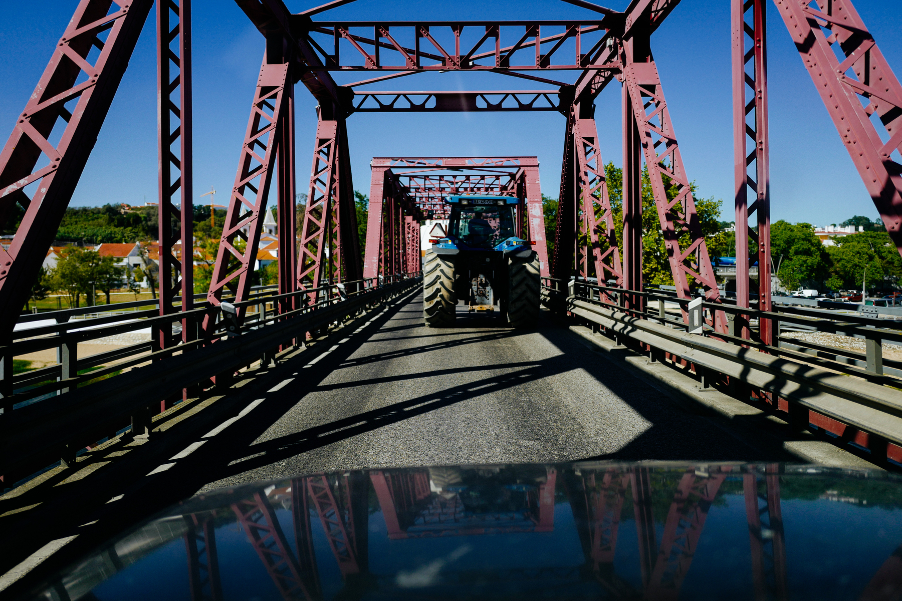 a tractor on a pink bridge