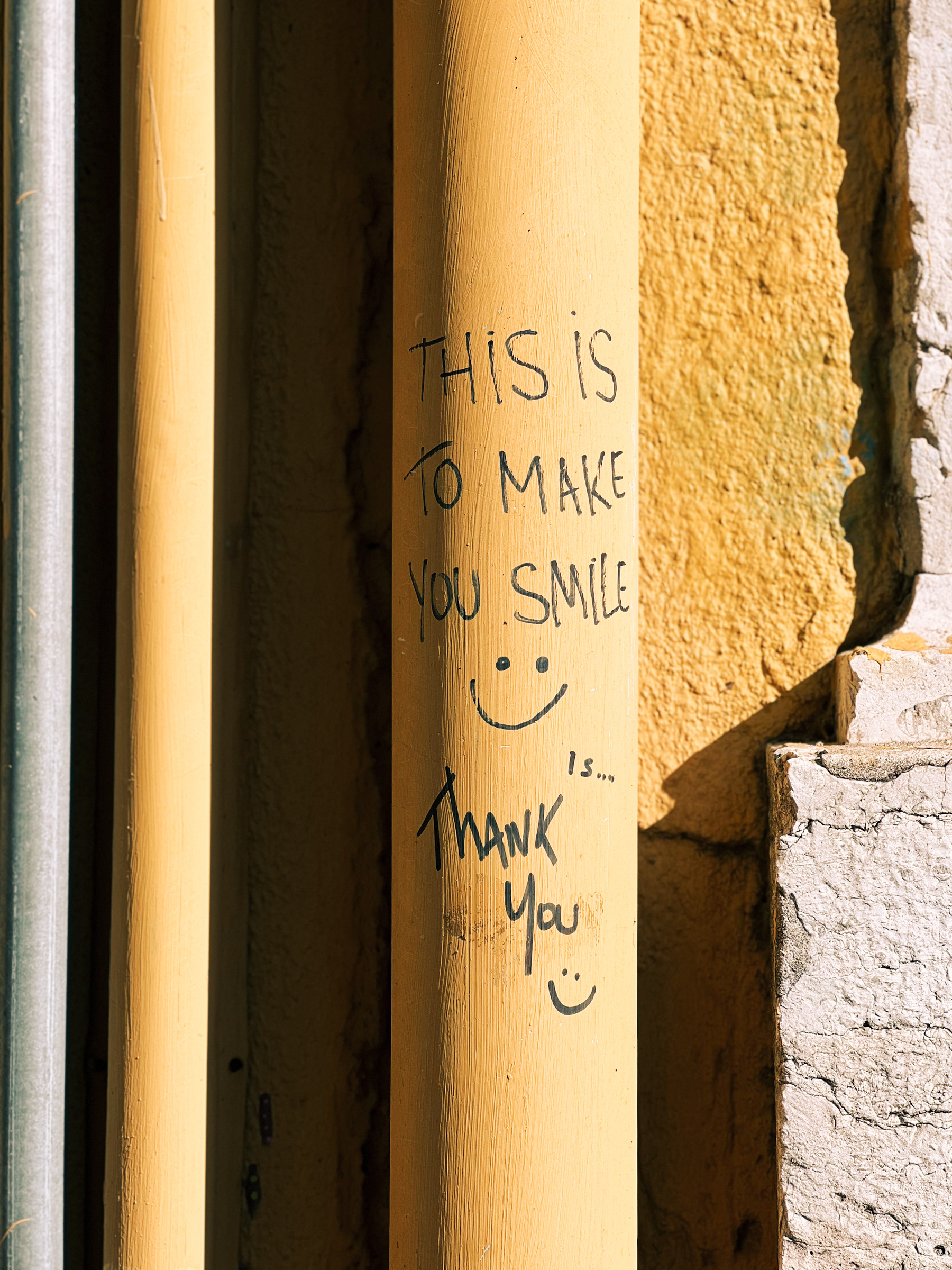 A pipe with “this is to make you smile, thank you” written on it. 