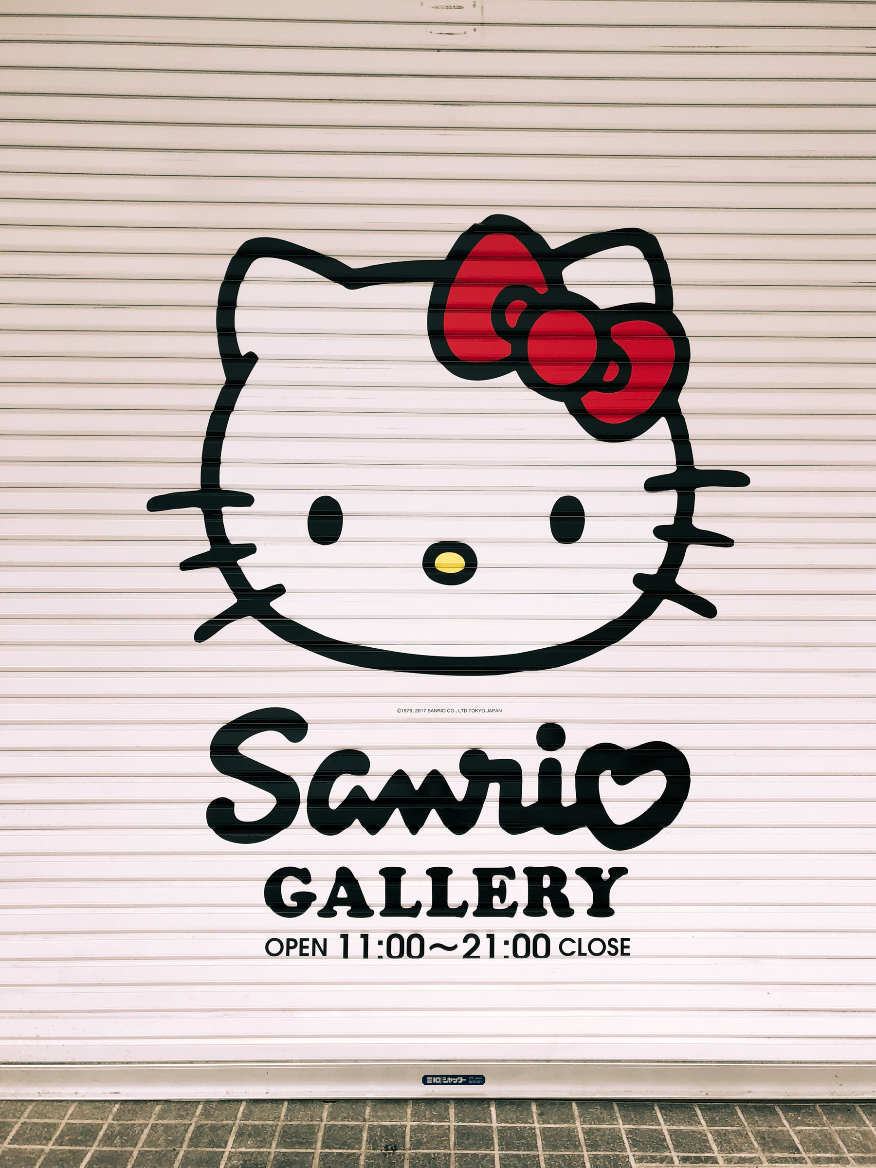 A closed shop, with Hello Kitty on the door.