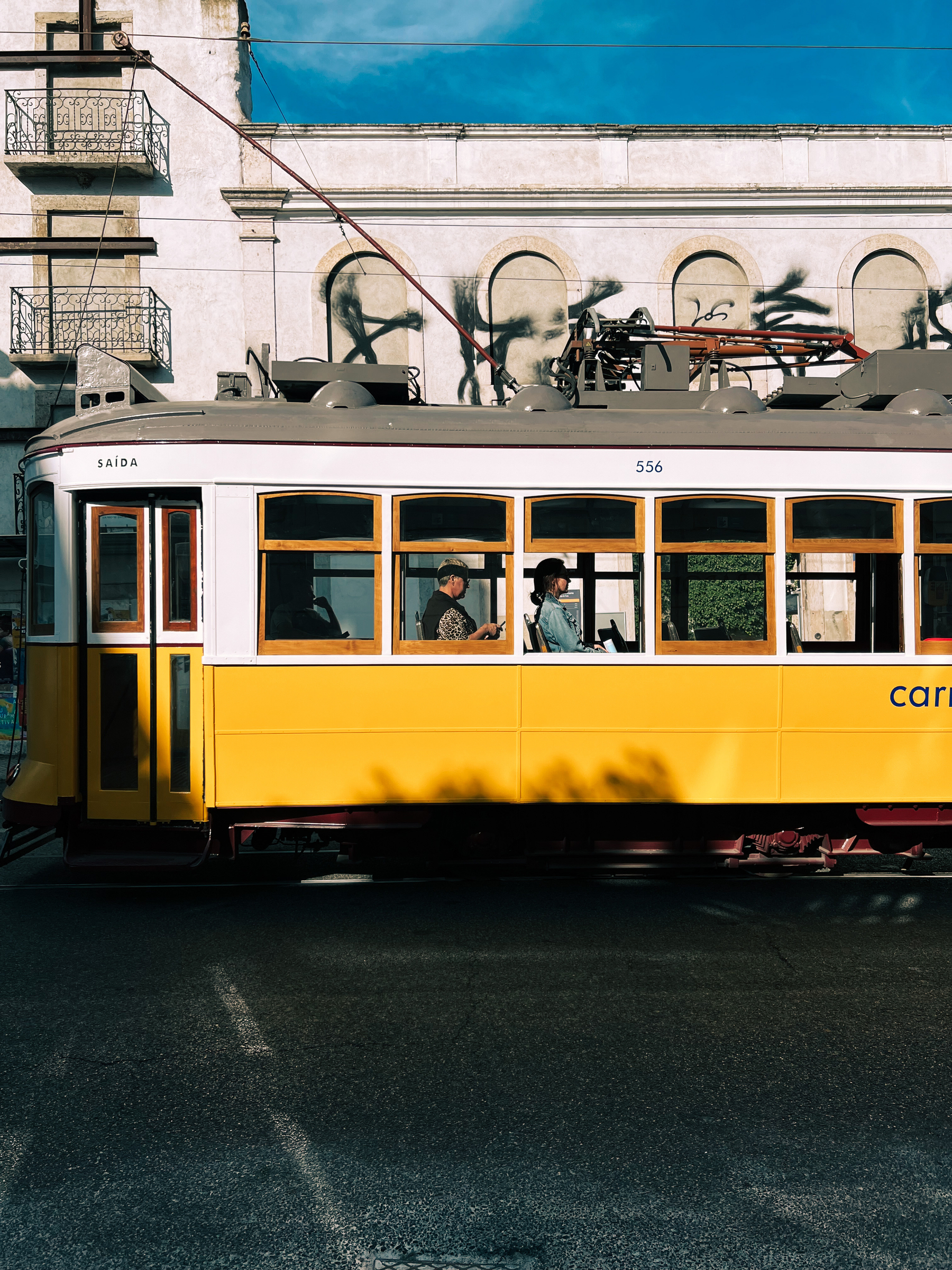 People travel in a tram. 