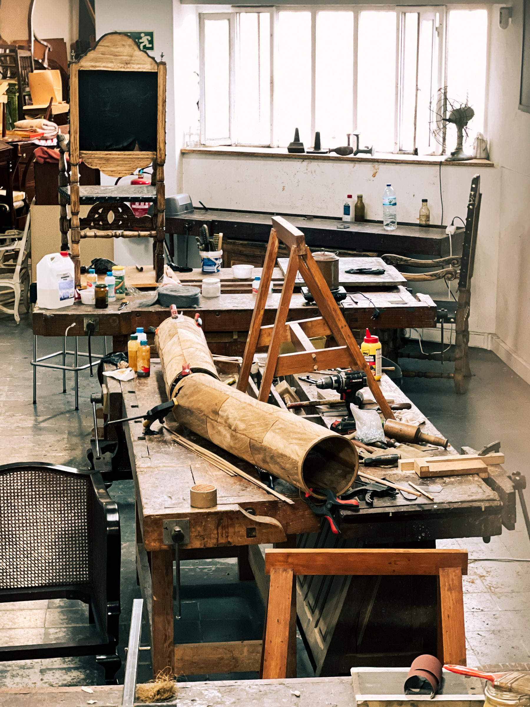 A studio, with assorted stuff on a table. 