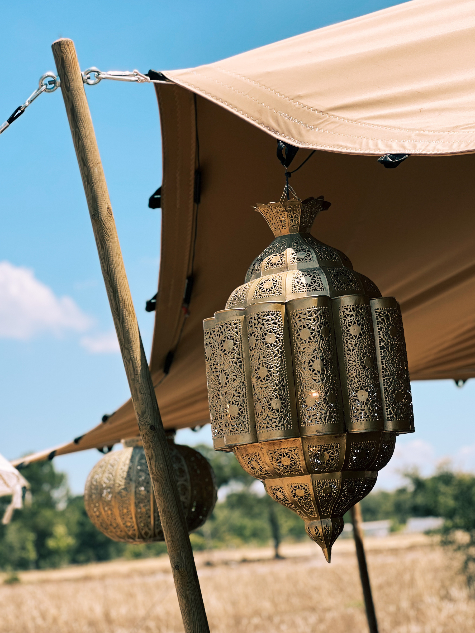 Lamps hanging from a tent. 