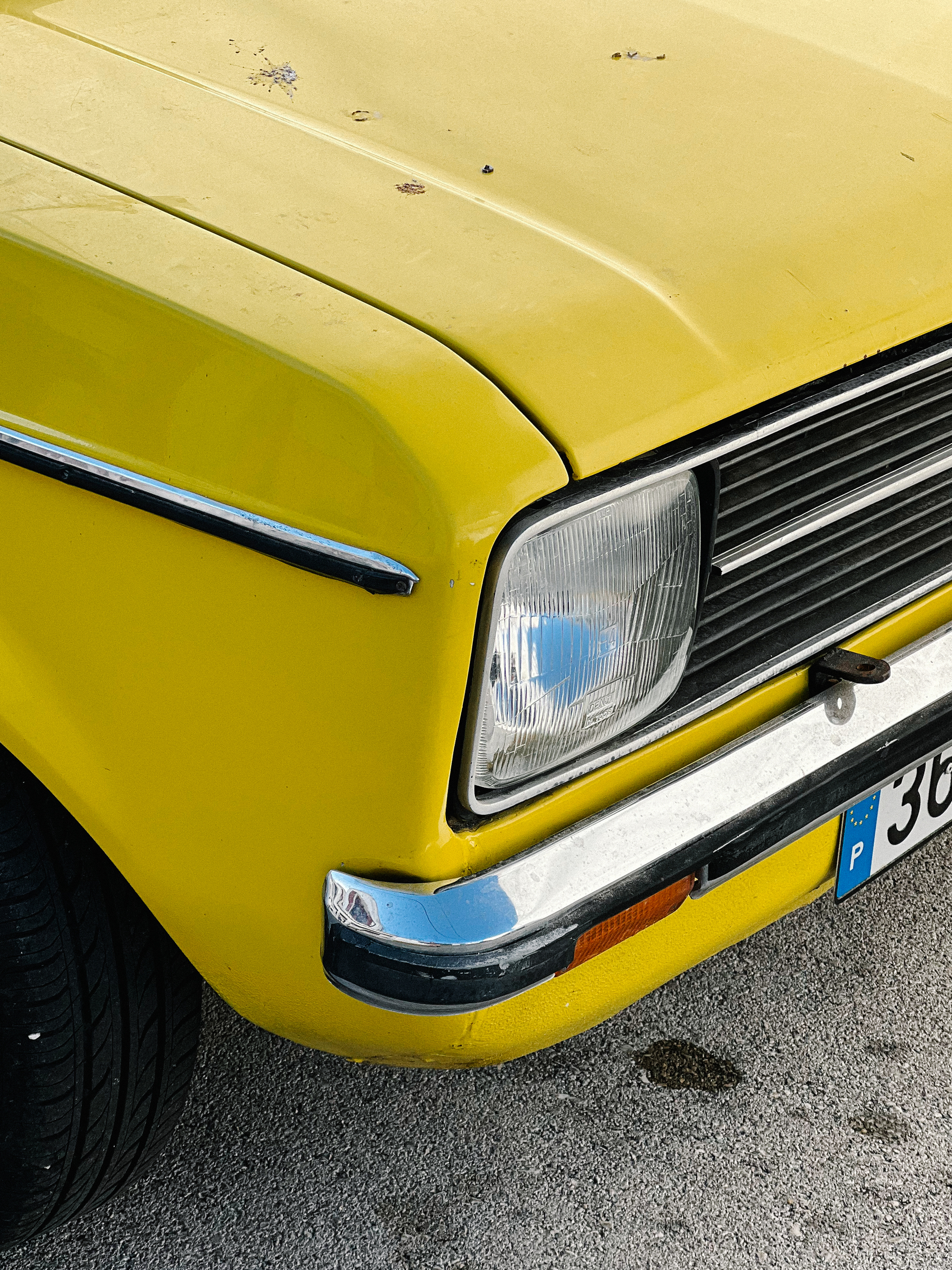 Detail of a yellow vintage Ford.