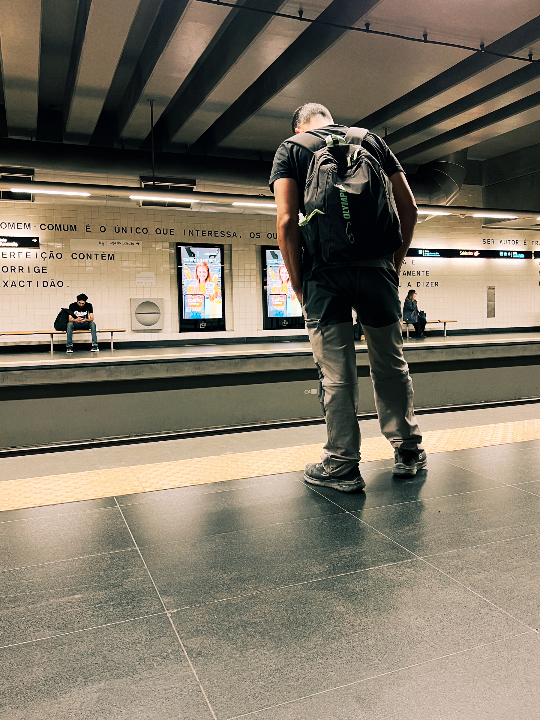 A man inside a subway station. 