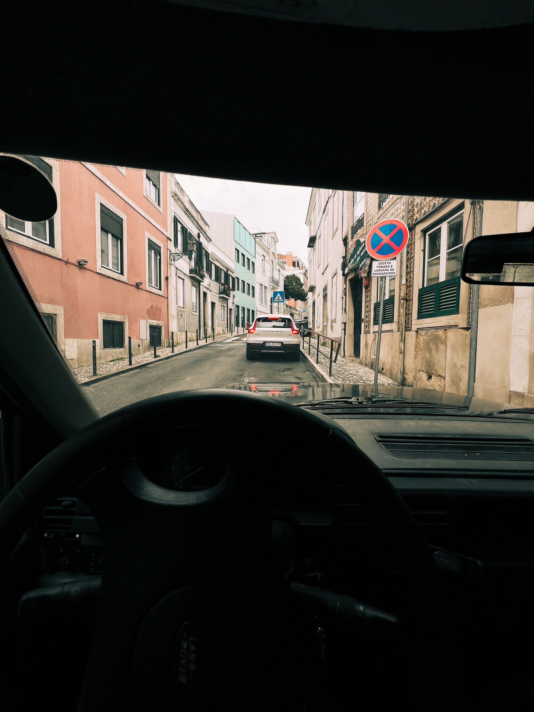 Parked on a side street. View from inside a car.