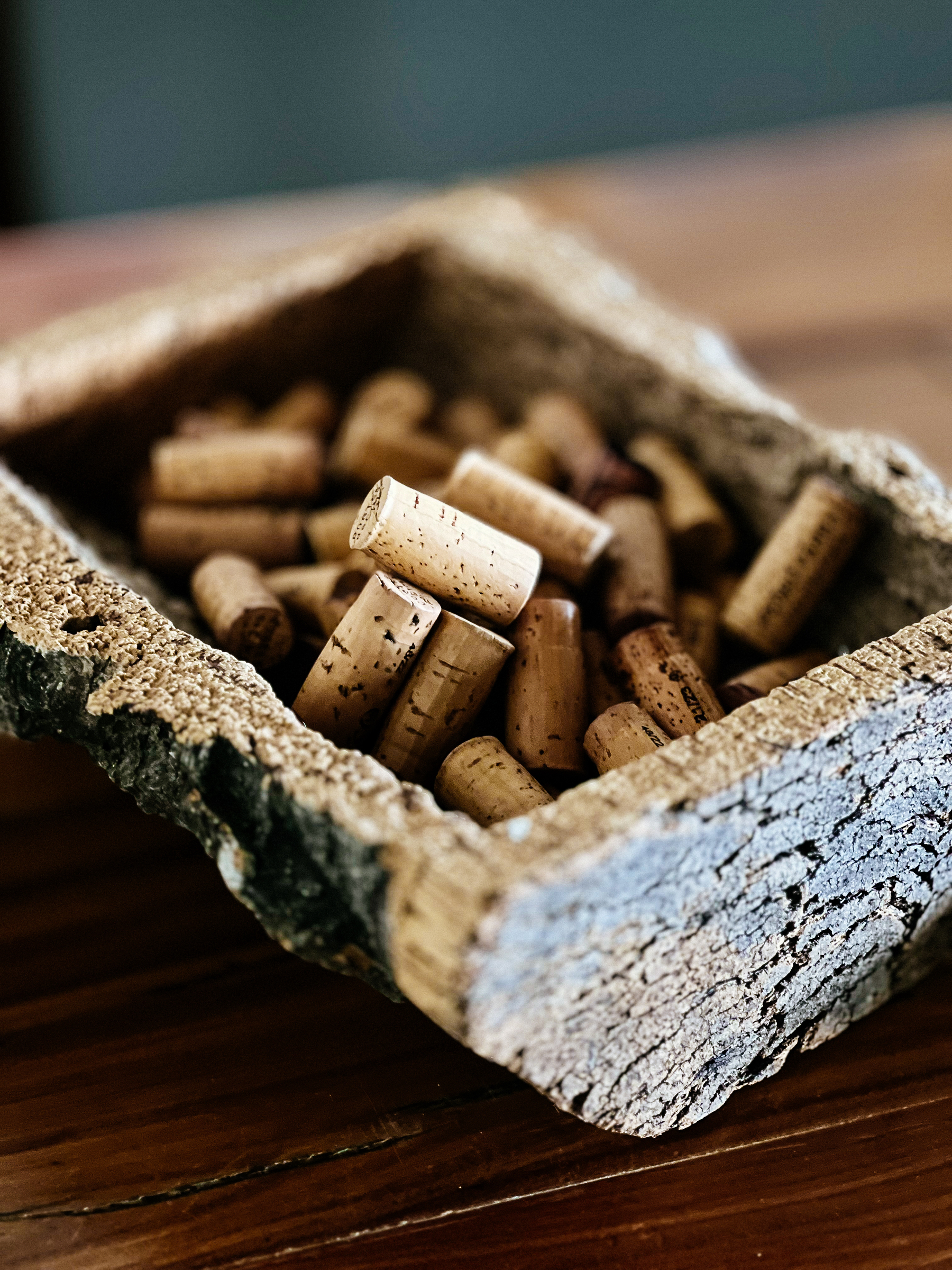 Wine corks, in a cork container. 