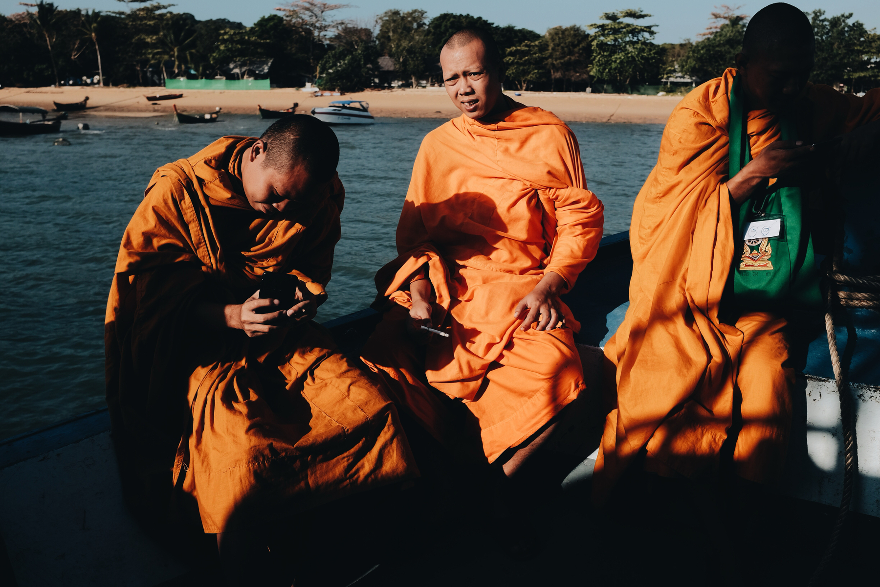 Buddhist monks riding in a boat.