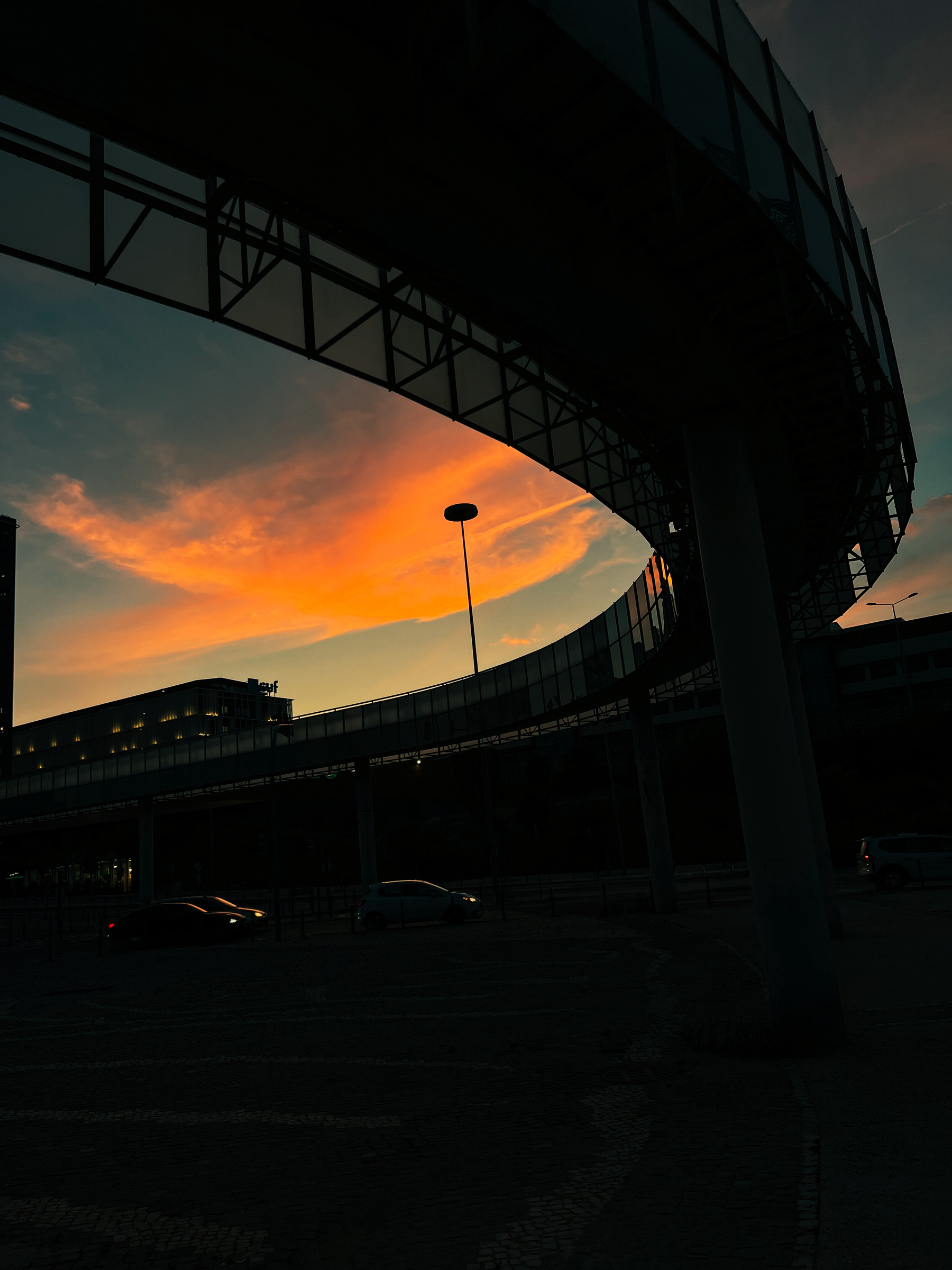 Sunset near an industrial structure.