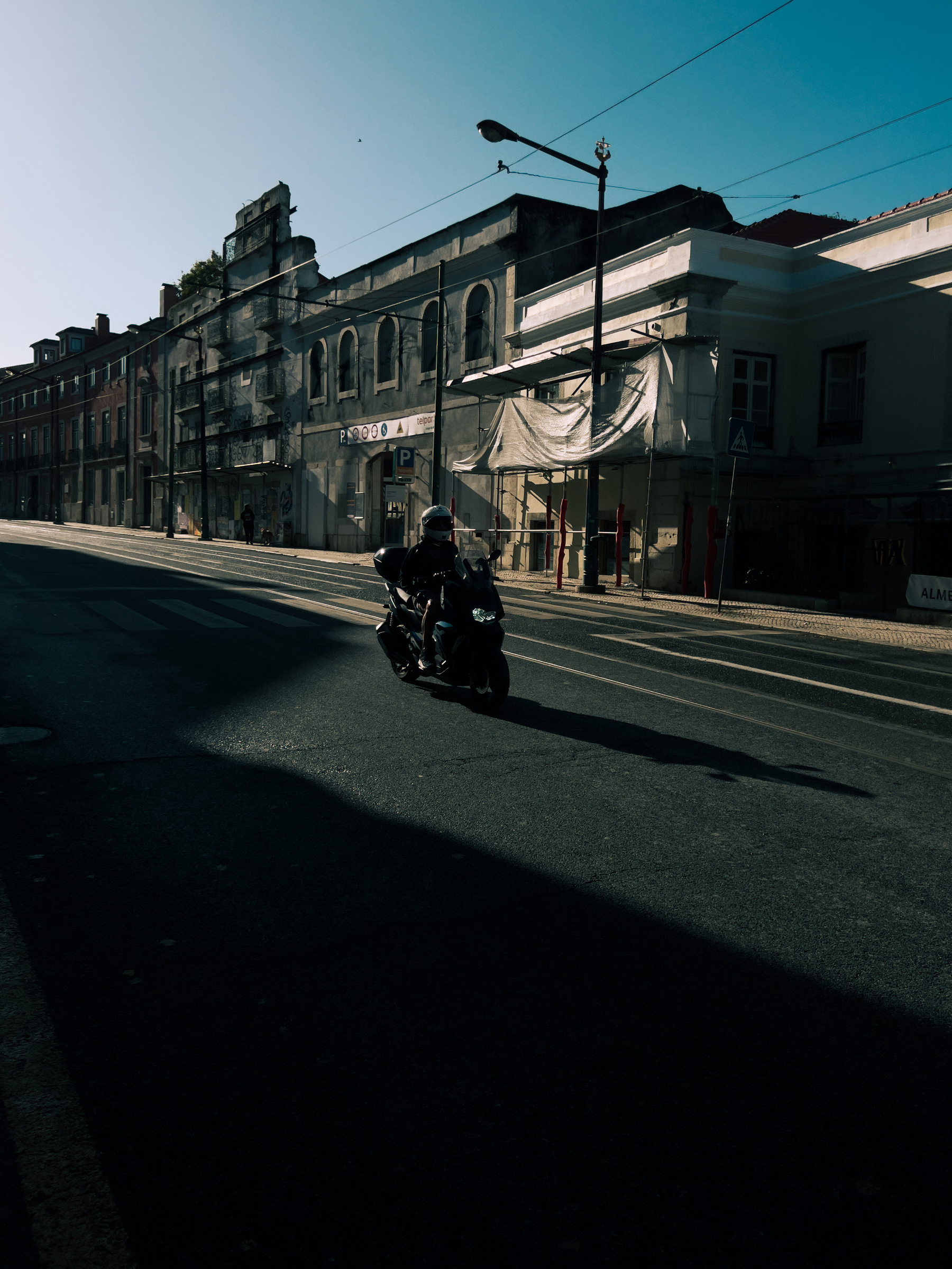 A lone motorcycle riding by.