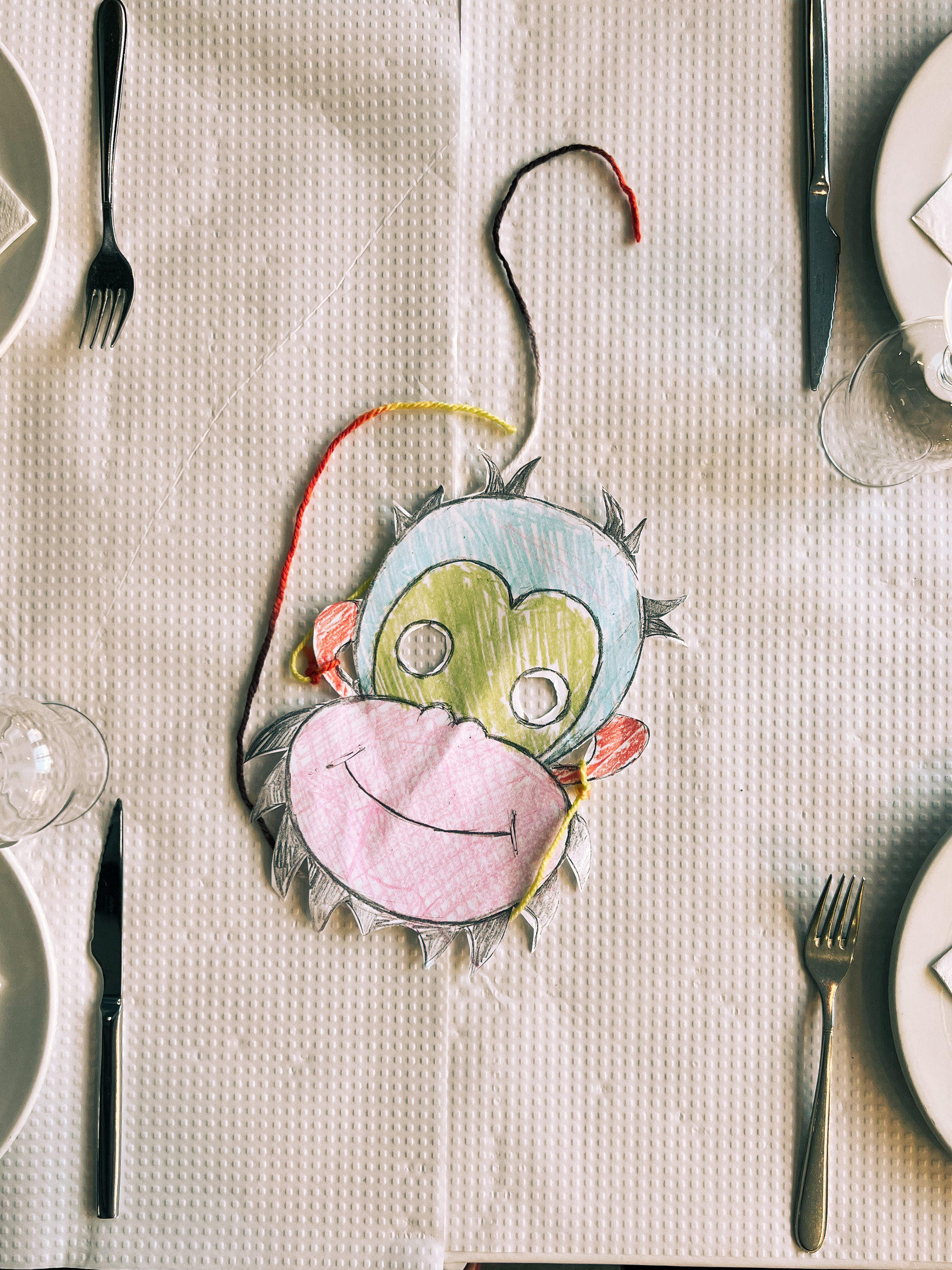 A monkey-like mask, on a table. 