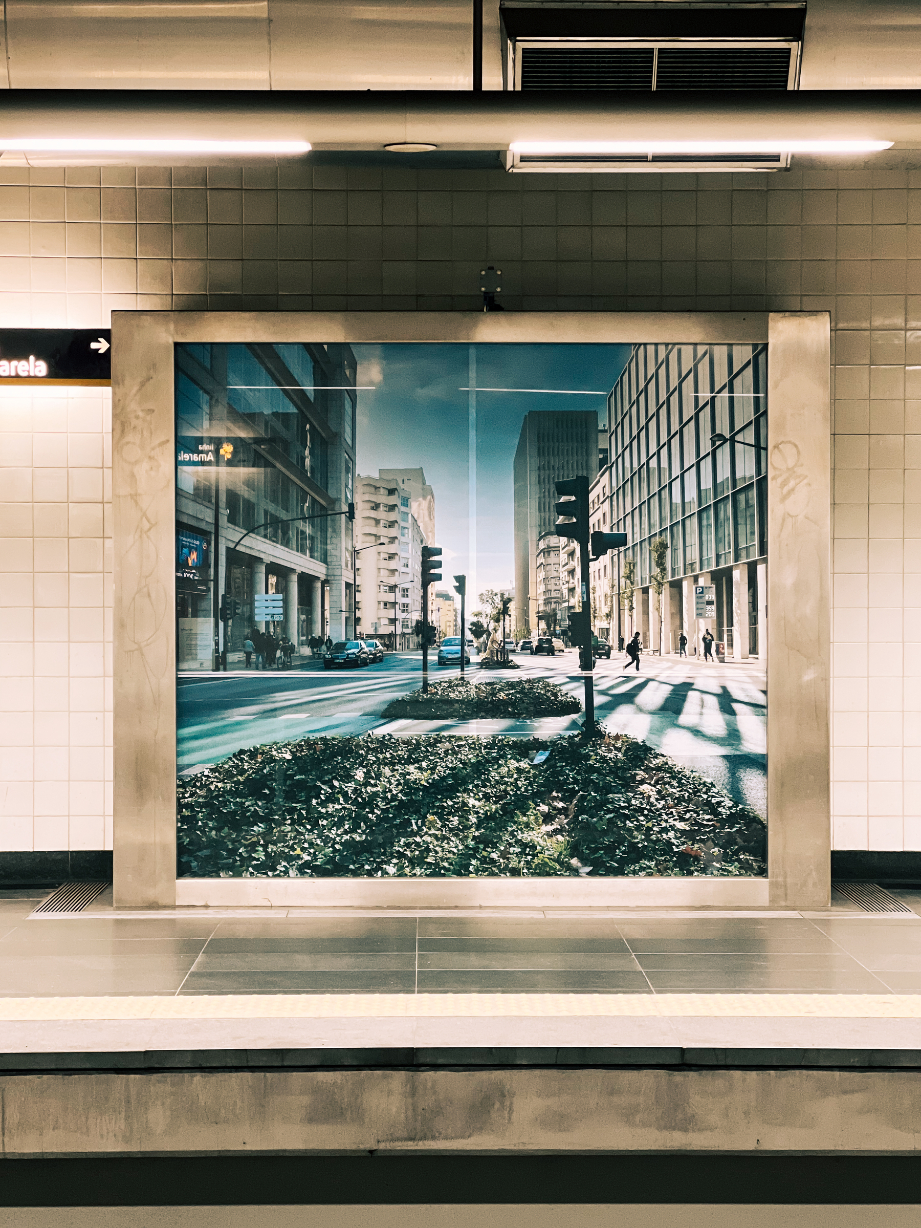 A cityscape photo on display on the subway.