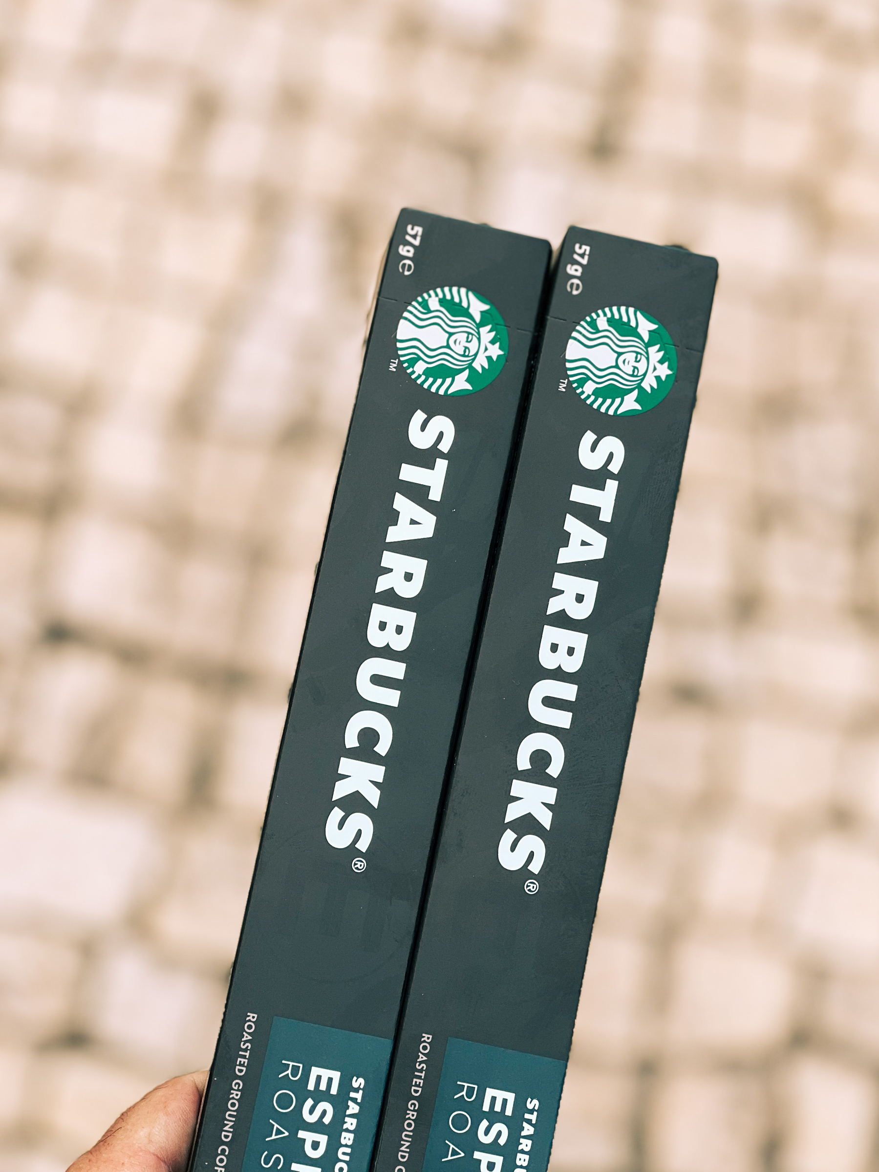 Two boxes of Starbucks capsules for a Nespresso machine. 