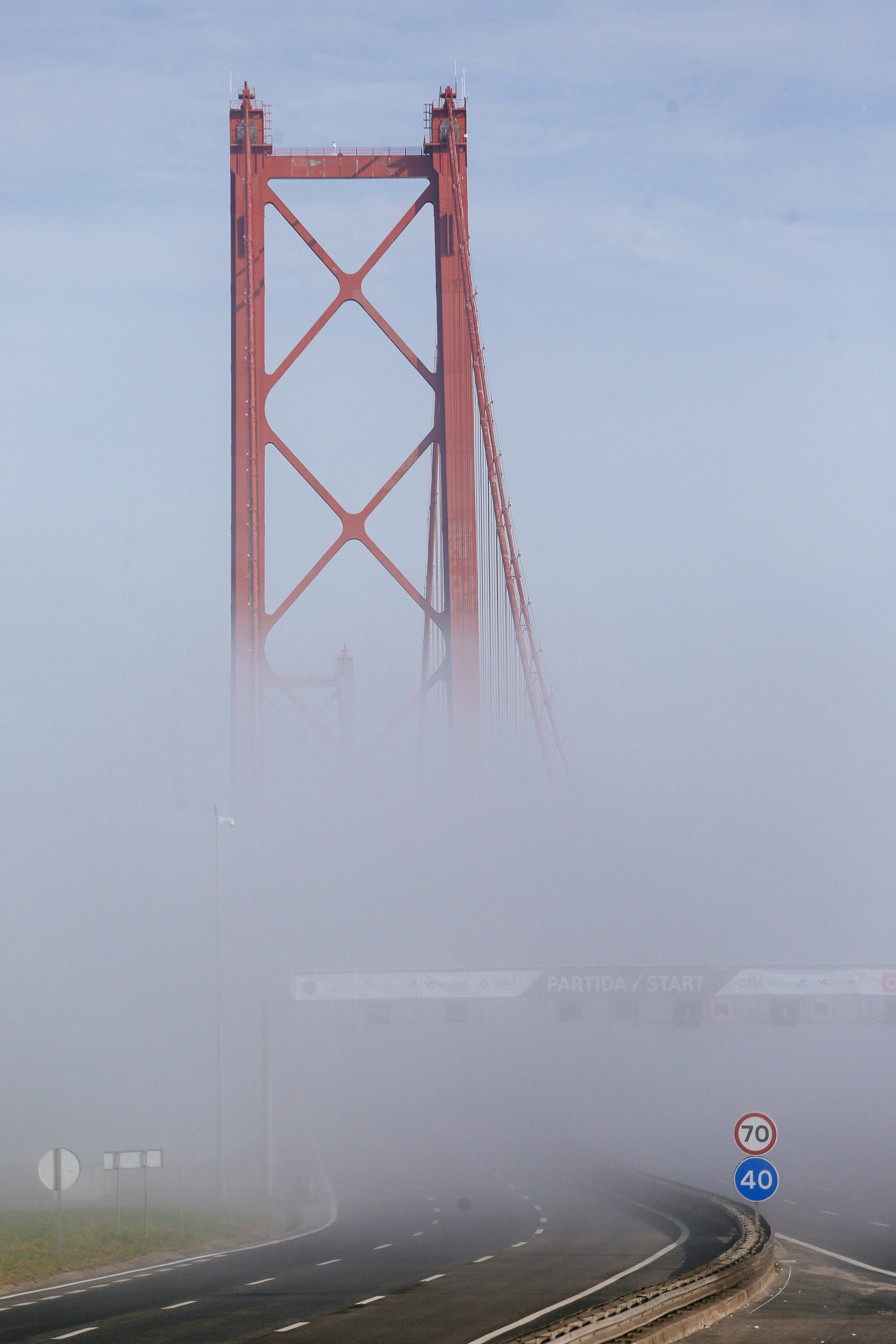 Foggy. A bridge rising out of the fog. 