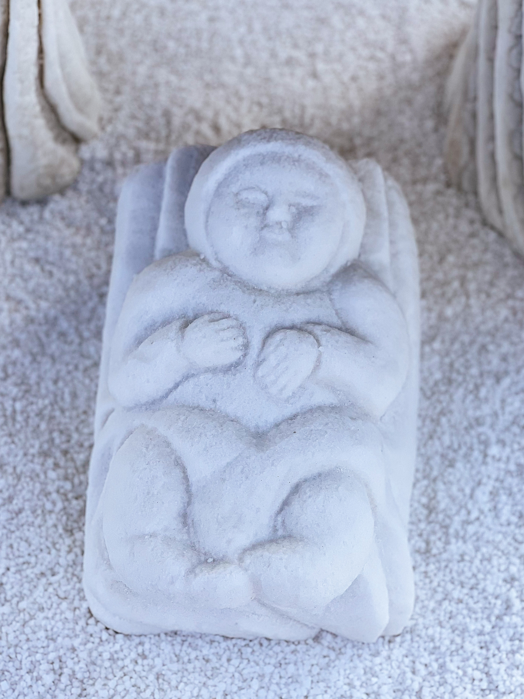 One baby Jesus image from a nativity scene made out of salt. 