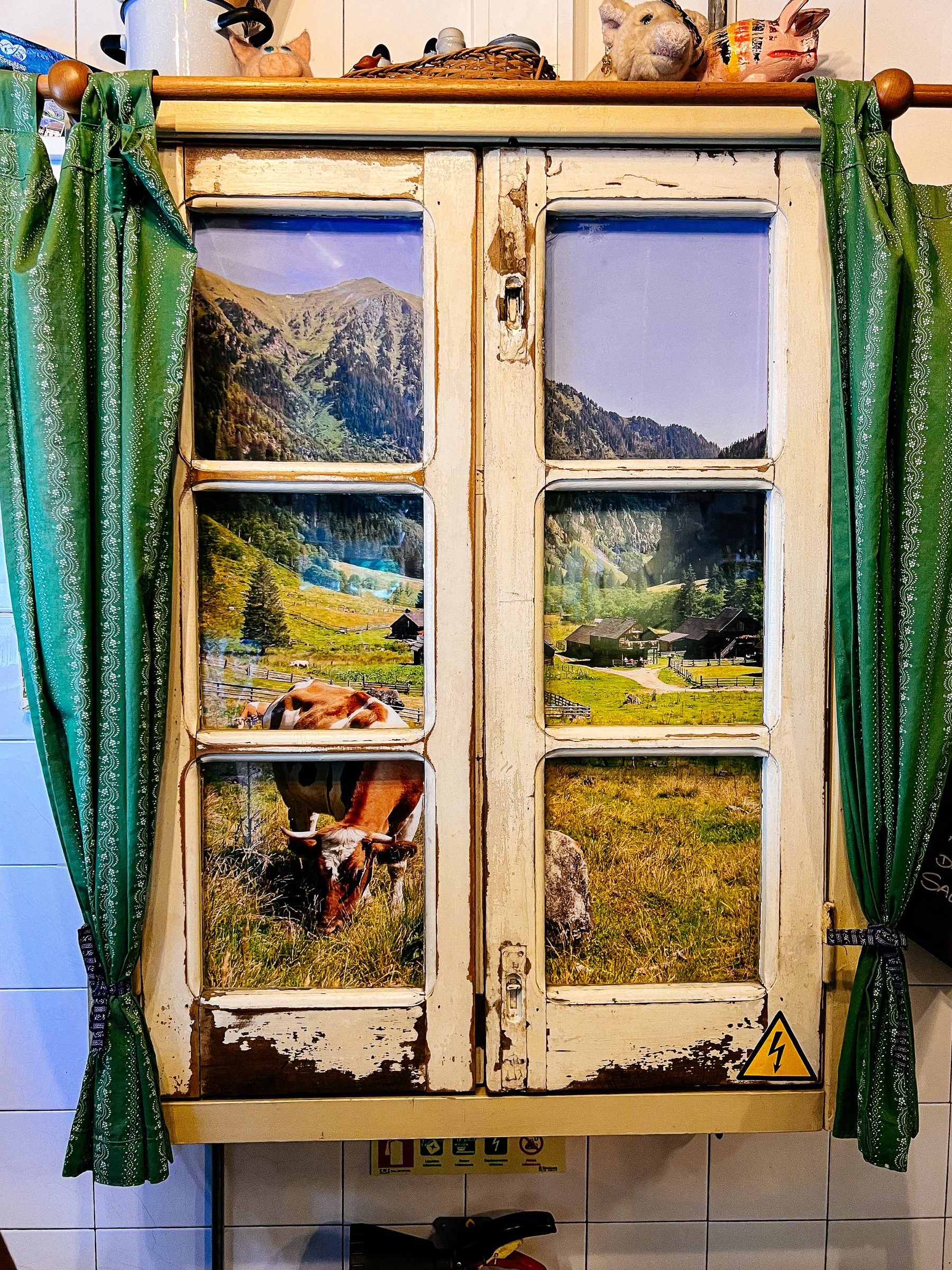 A wooden window, with a photo inside it.