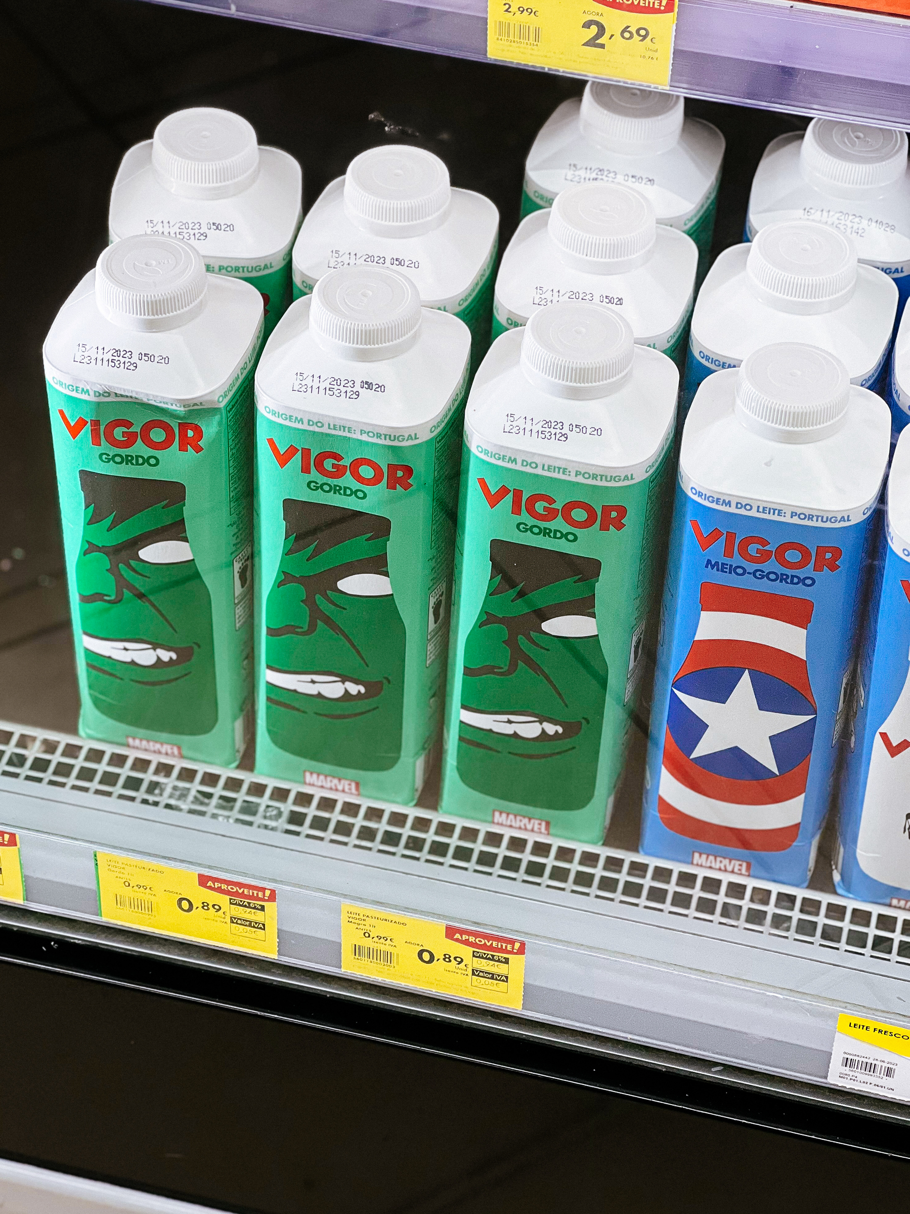 Milk cartons in a supermarket fridge. Some have Hulk on the side, others Captain America’s branding. 