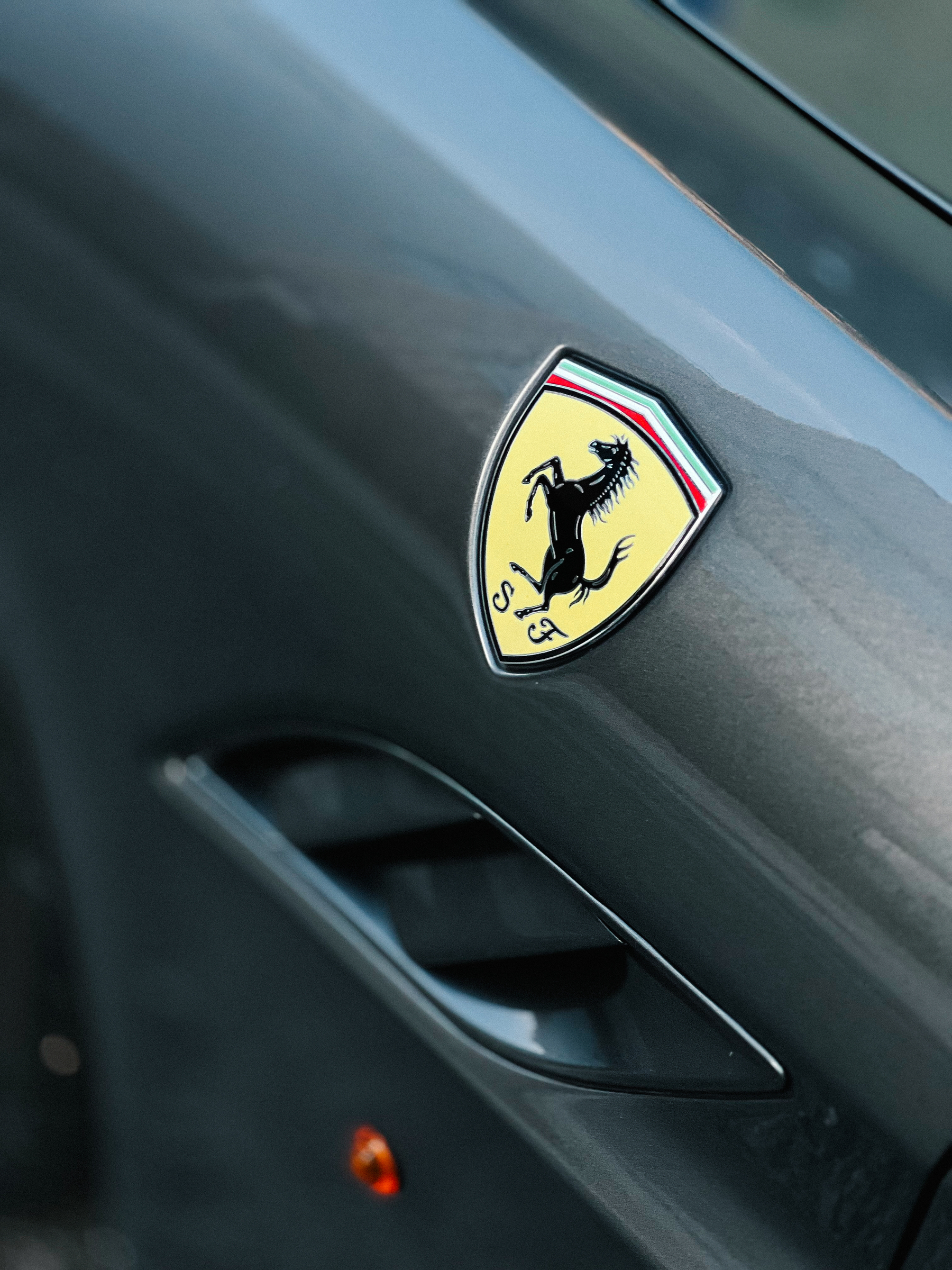 Detail of a Ferrari, the logo. 