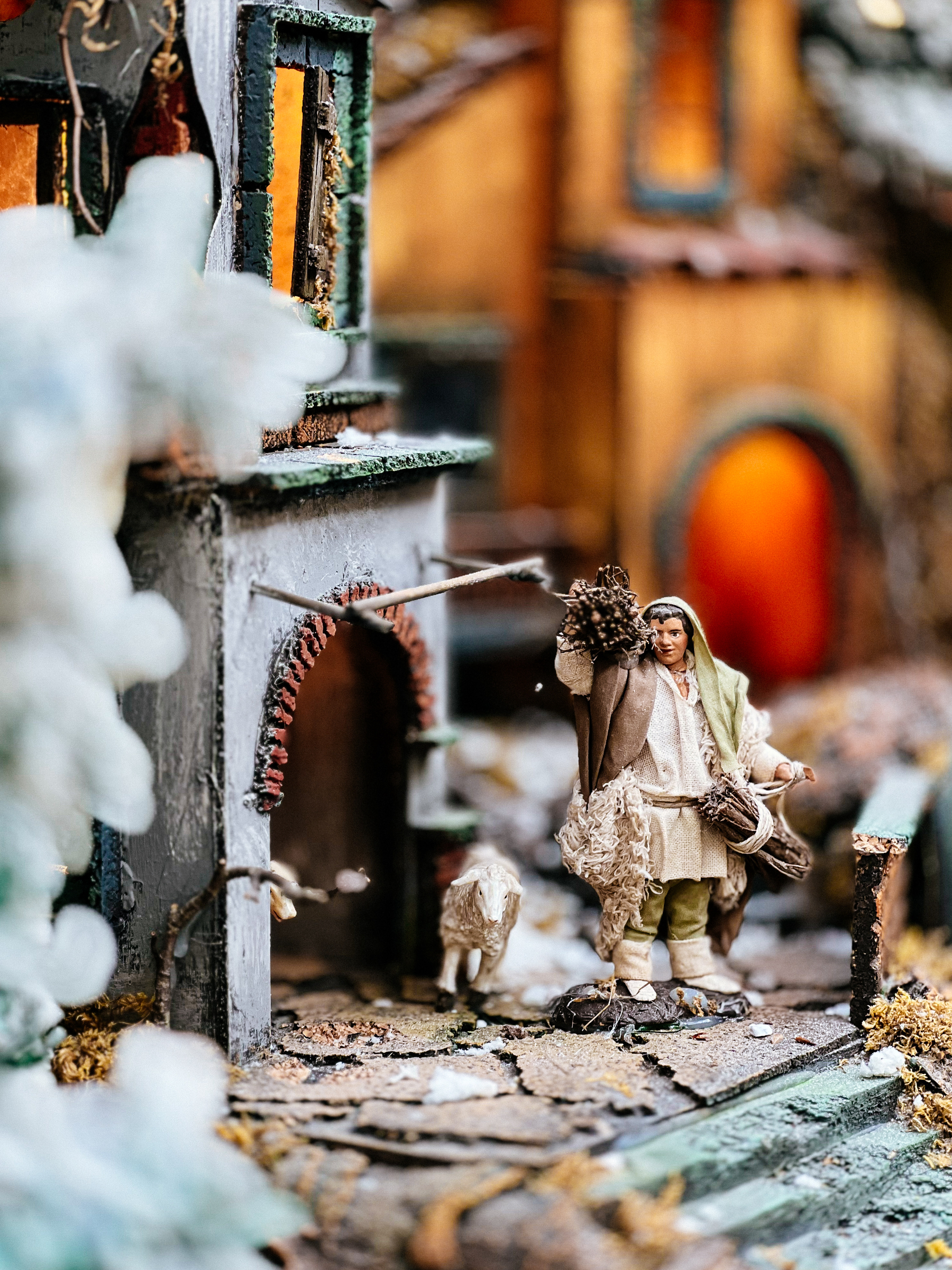 A character in a nativity scene. A man with sheep. 