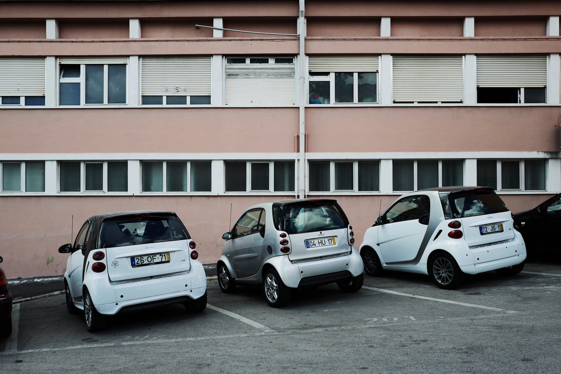 Three Smart cars parked. 