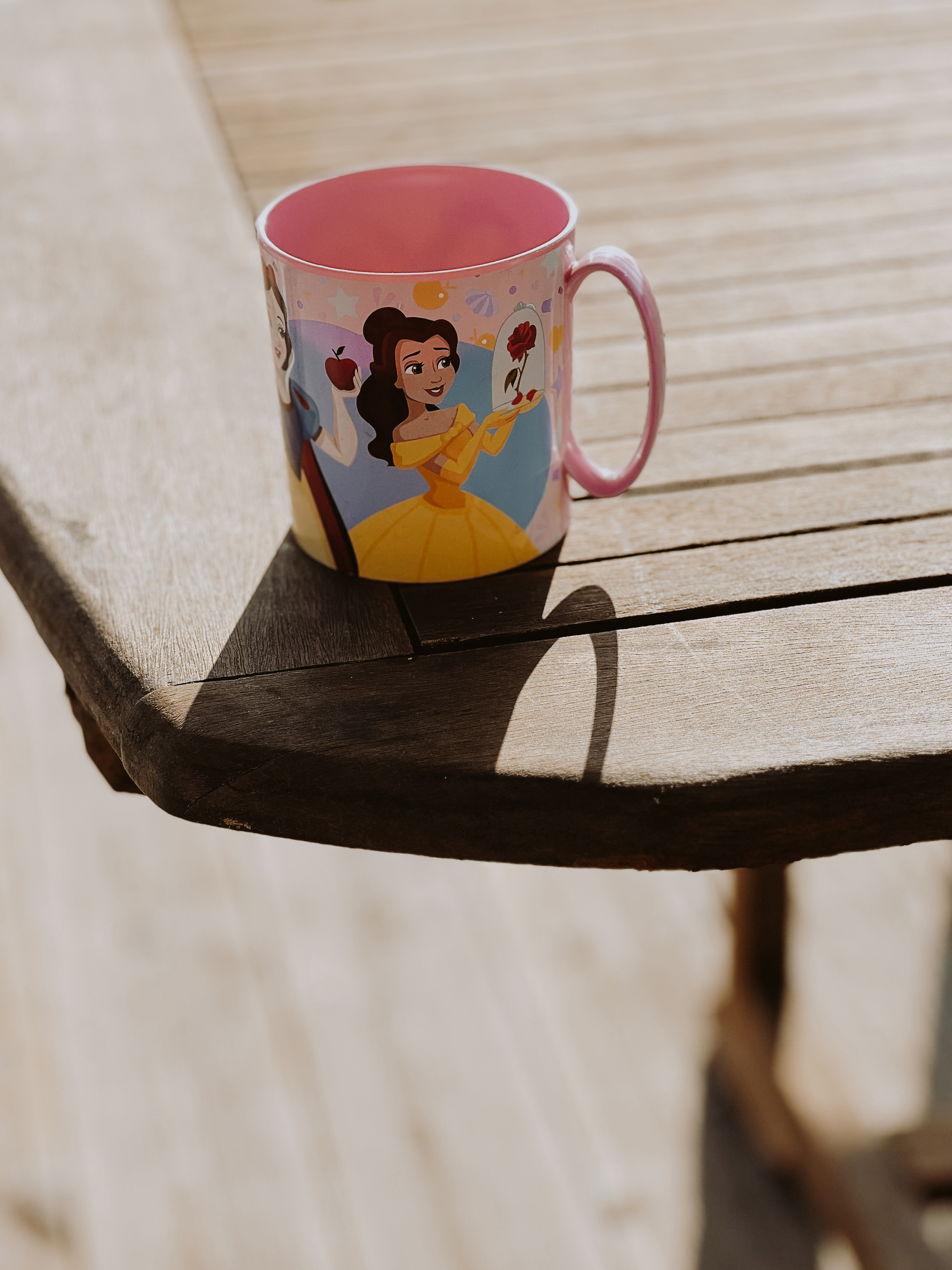 A coffee mug with Disney characters.