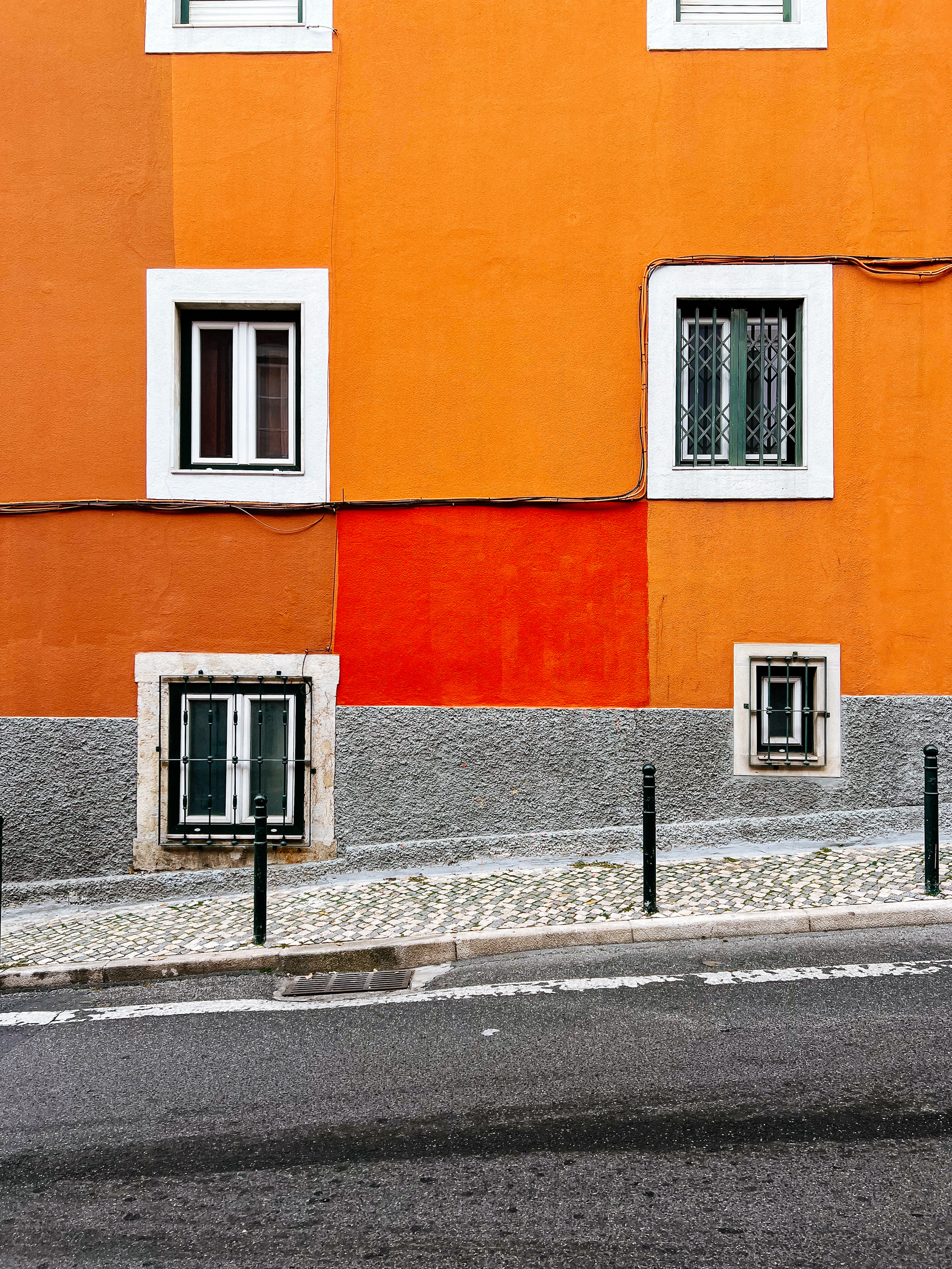 a dark orange square, on a lighter orange building.