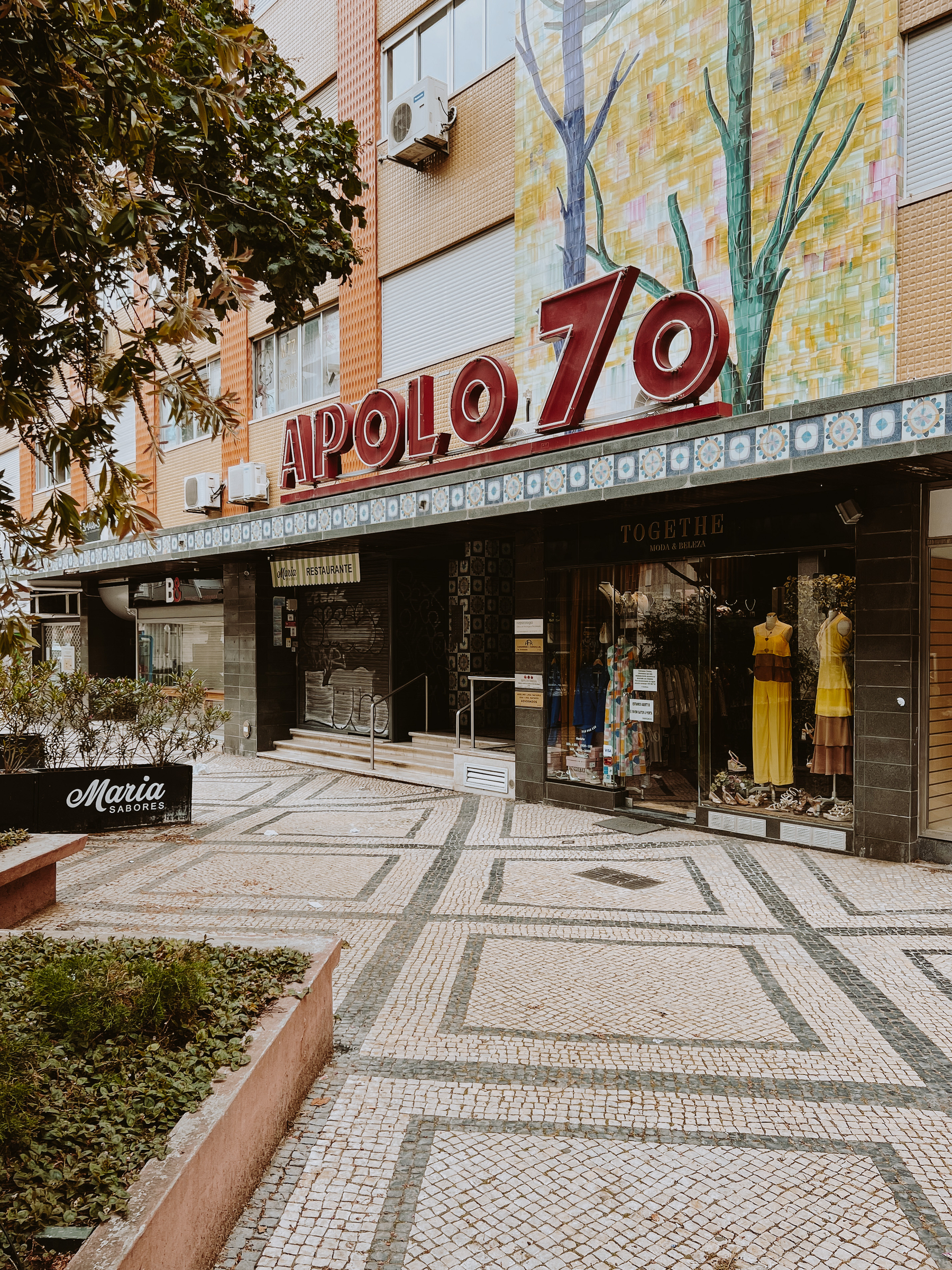 “Apolo 70”, a classic drugstore in town. Vintage looking font on the display, vintage tiles on the facade. 