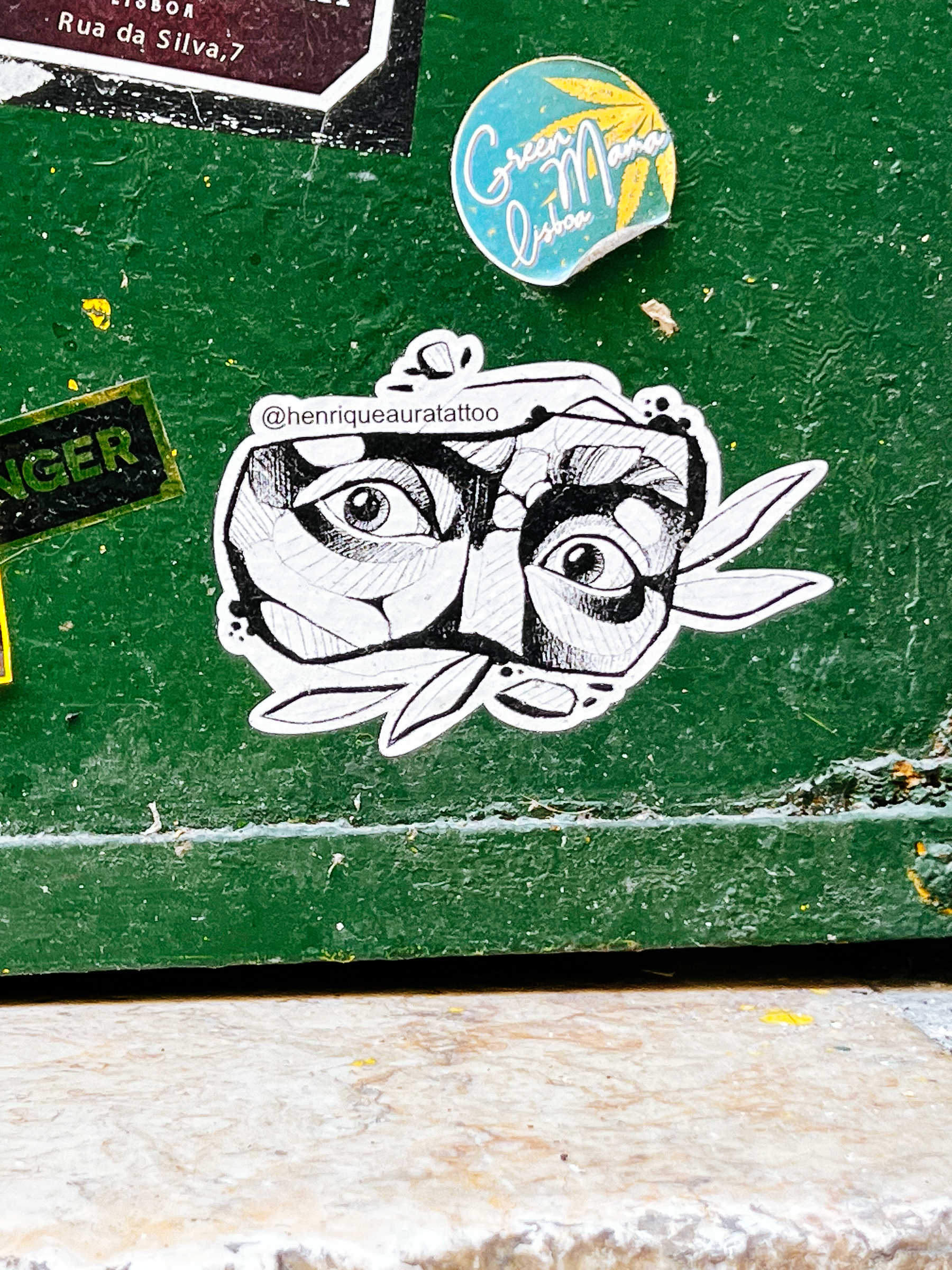 A sticker. Eyes. As if carved from a lump of stone. 