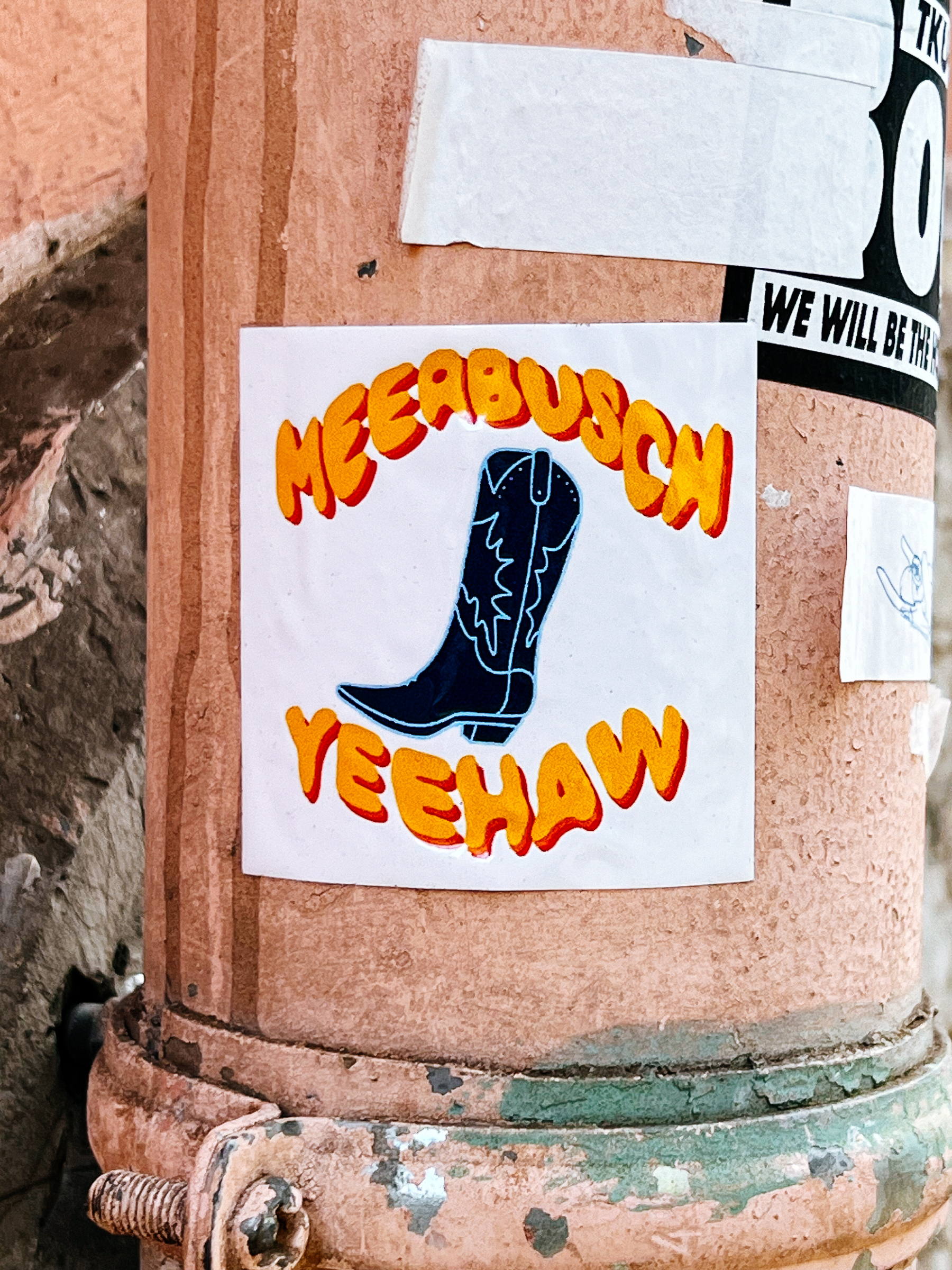 &ldquo;Meerbusch Yeehaw&rdquo;, and a cowboy boot. On a sticker. 